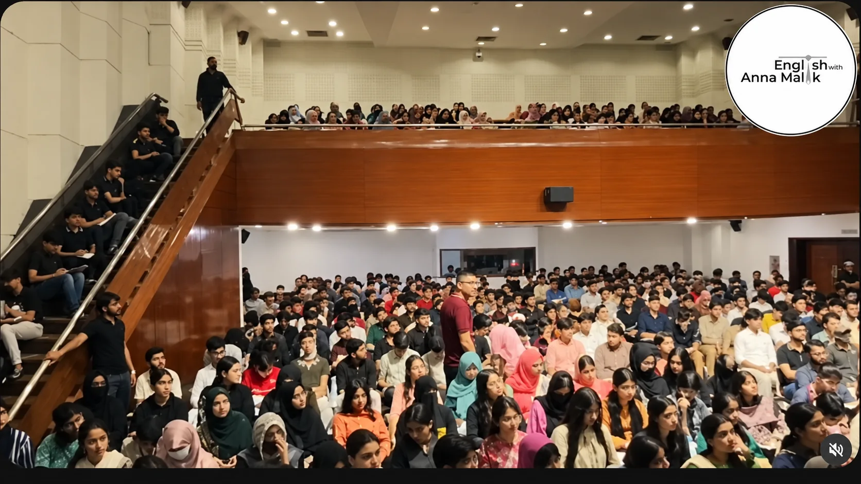 Students attending a session in a large lecture hall